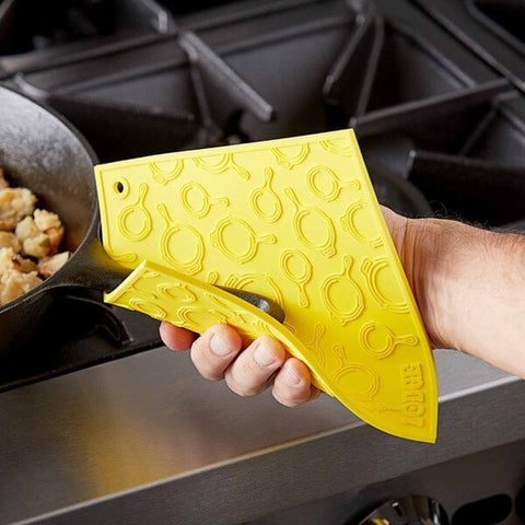 Lodge Manufacturing AS7SKT21 7" x 7" Yellow Skillet Pattern Silicone Trivet / Pot Holder